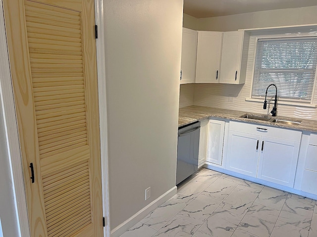 kitchen featuring white cabinetry, sink, dishwasher, and light stone countertops