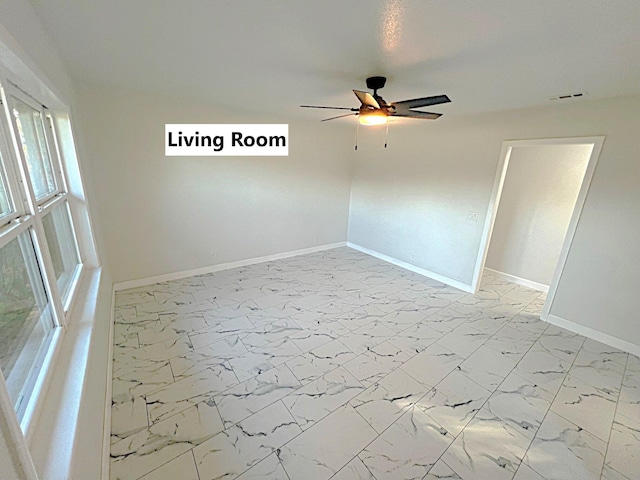 spare room with ceiling fan