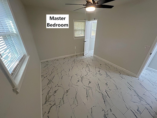 spare room featuring ceiling fan