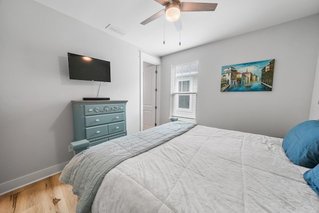 bedroom with hardwood / wood-style floors and ceiling fan