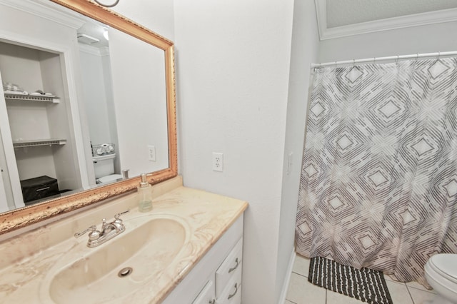 bathroom featuring ornamental molding, vanity, a textured ceiling, tile patterned flooring, and toilet