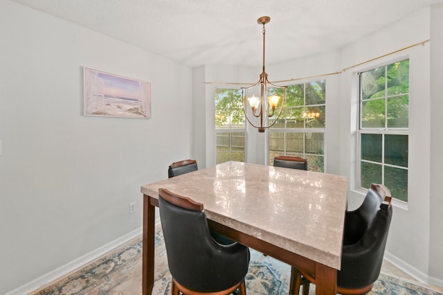 dining space featuring a chandelier