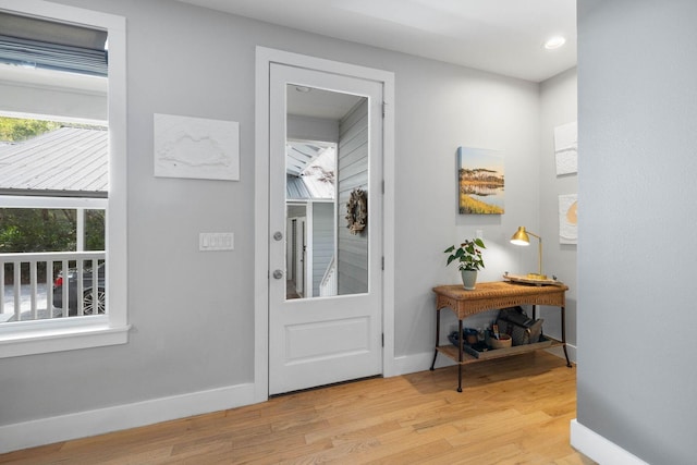 foyer entrance with light hardwood / wood-style floors