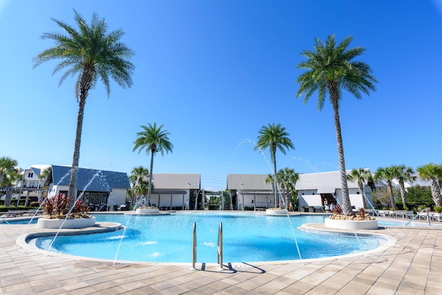 view of swimming pool featuring a patio and pool water feature