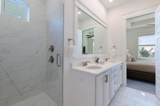 bathroom with vanity, hardwood / wood-style floors, and a shower with shower door