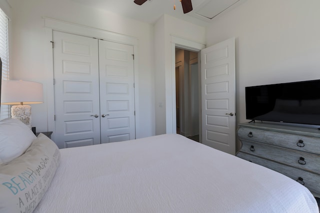 bedroom with ceiling fan and a closet