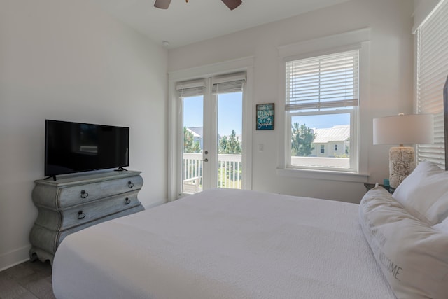 bedroom featuring access to exterior, hardwood / wood-style floors, and ceiling fan