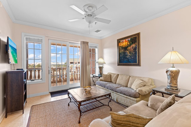 living room featuring light tile patterned floors, ceiling fan, and ornamental molding