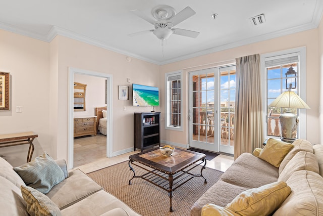 living room with light tile patterned floors, ceiling fan, and crown molding