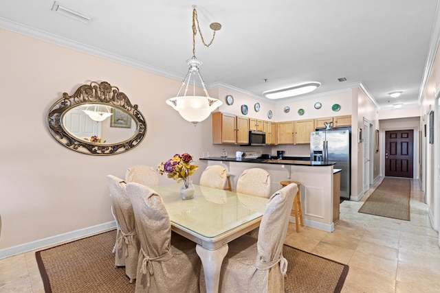 dining space with light tile patterned floors and ornamental molding