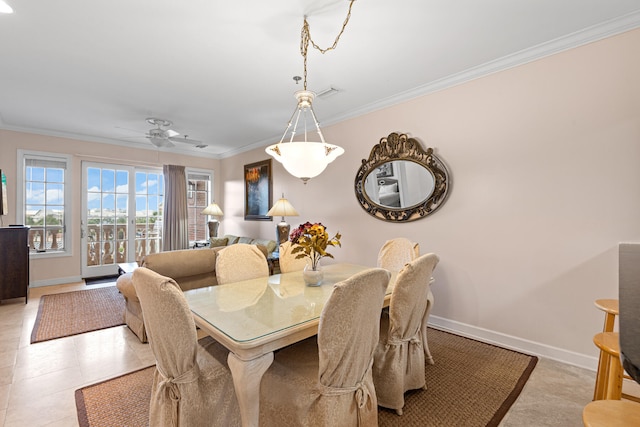 dining room featuring light tile patterned floors, ceiling fan, and crown molding