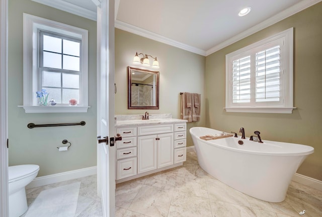 bathroom with a bathing tub, toilet, vanity, and ornamental molding