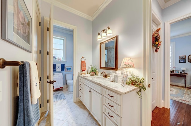 bathroom with crown molding, tile patterned flooring, vanity, and toilet