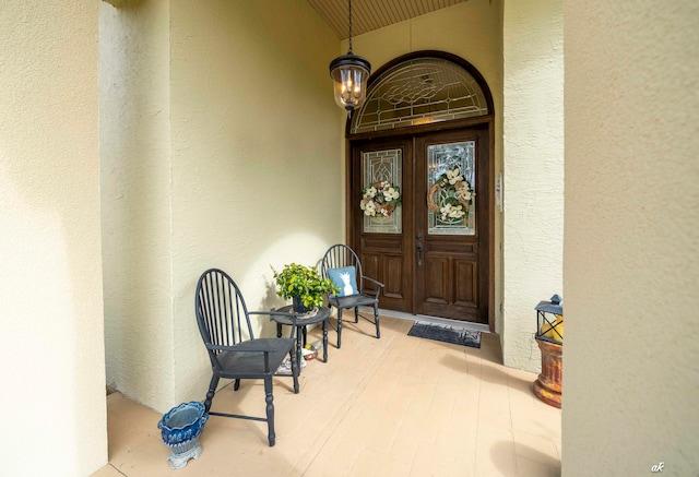 property entrance with covered porch