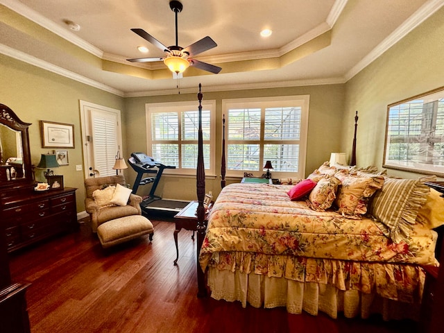 bedroom featuring dark hardwood / wood-style flooring, multiple windows, ornamental molding, and ceiling fan