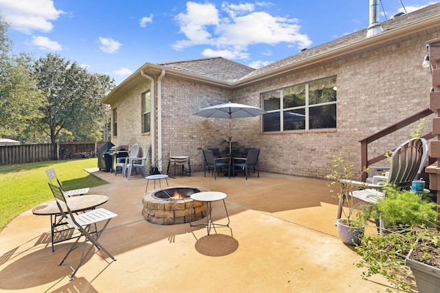 view of patio featuring a fire pit and grilling area