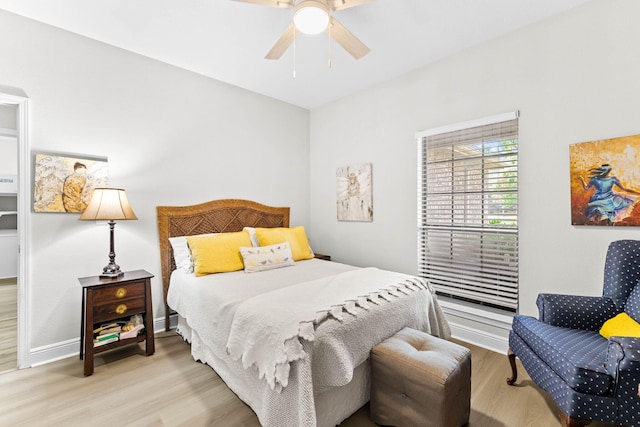 bedroom featuring ceiling fan and light hardwood / wood-style flooring