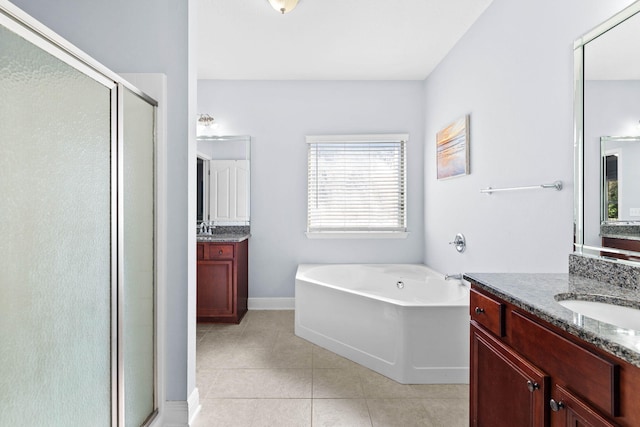 bathroom featuring vanity, tile patterned flooring, and plus walk in shower