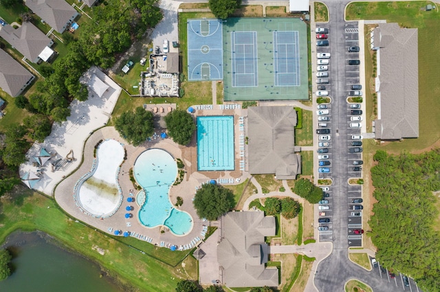 birds eye view of property with a water view