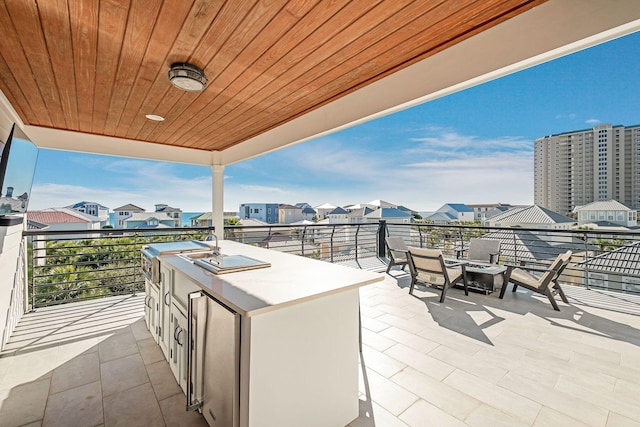 view of patio / terrace with a balcony