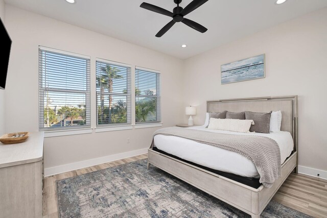 bedroom featuring ceiling fan and light hardwood / wood-style floors