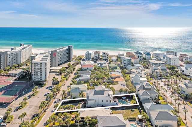 aerial view with a water view and a view of the beach