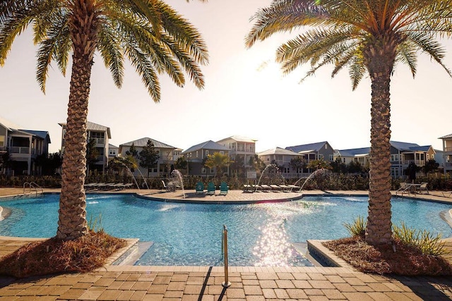 view of pool with pool water feature