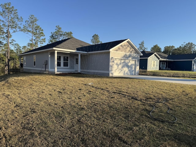 ranch-style house with a front yard and a garage