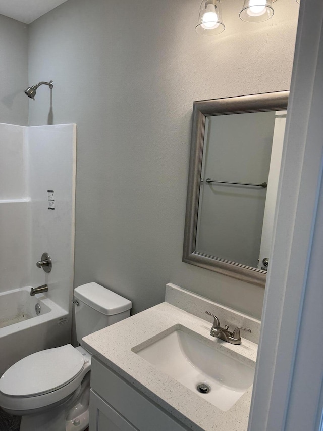 full bath with vanity, toilet, and bathing tub / shower combination