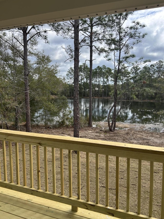 wooden terrace featuring a water view