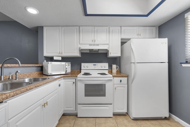 kitchen with white cabinets, a textured ceiling, white appliances, and sink