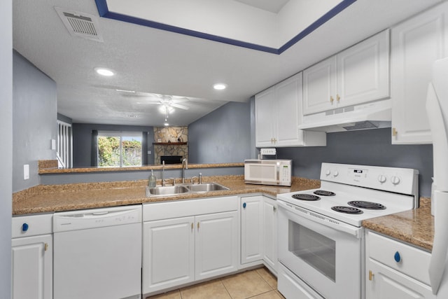 kitchen featuring a textured ceiling, sink, white cabinets, and white appliances