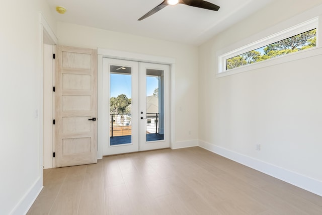 doorway to outside featuring light hardwood / wood-style flooring, ceiling fan, and french doors