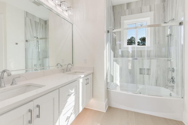 bathroom featuring vanity and enclosed tub / shower combo