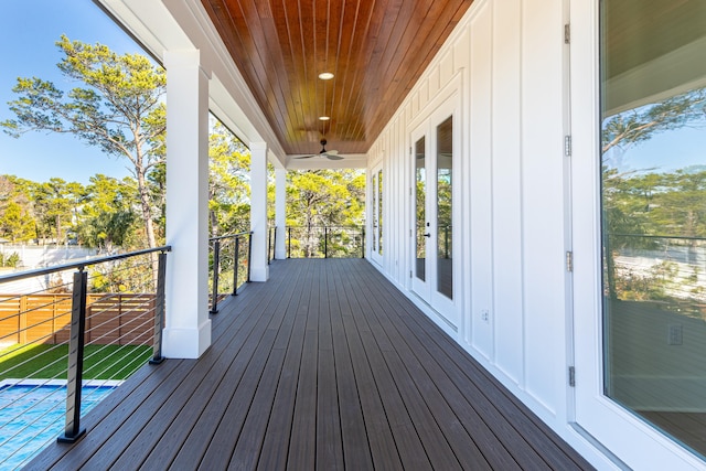 wooden deck featuring ceiling fan