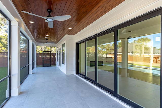 unfurnished sunroom with wooden ceiling