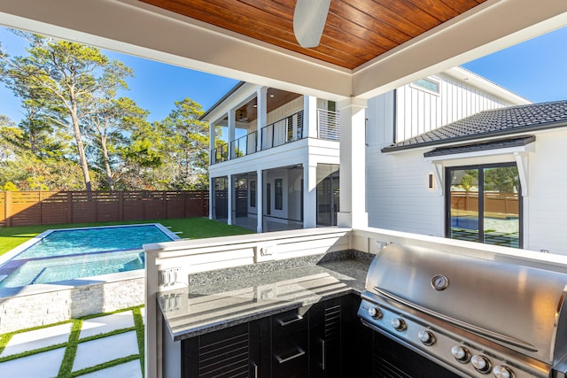 view of patio featuring area for grilling, a fenced in pool, grilling area, and ceiling fan