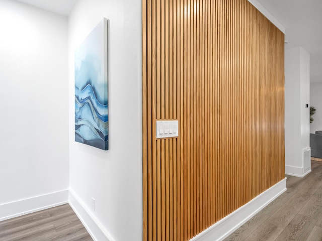 corridor featuring hardwood / wood-style floors