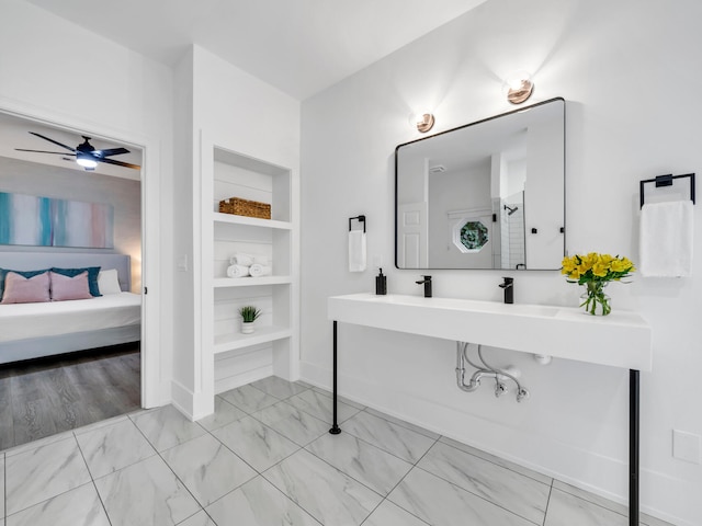 bathroom featuring built in shelves and ceiling fan