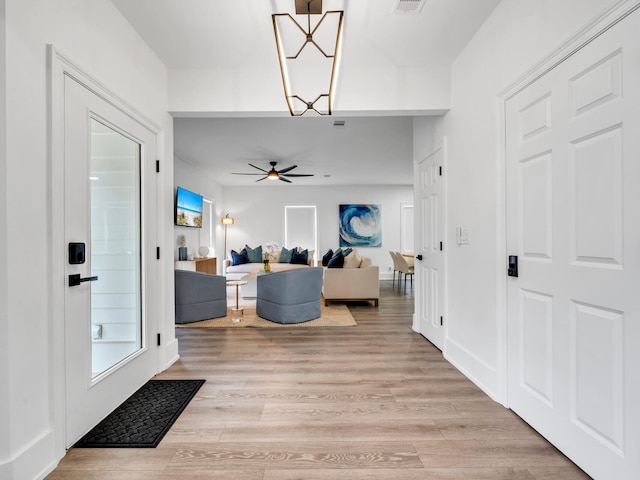 entrance foyer featuring light hardwood / wood-style flooring and ceiling fan