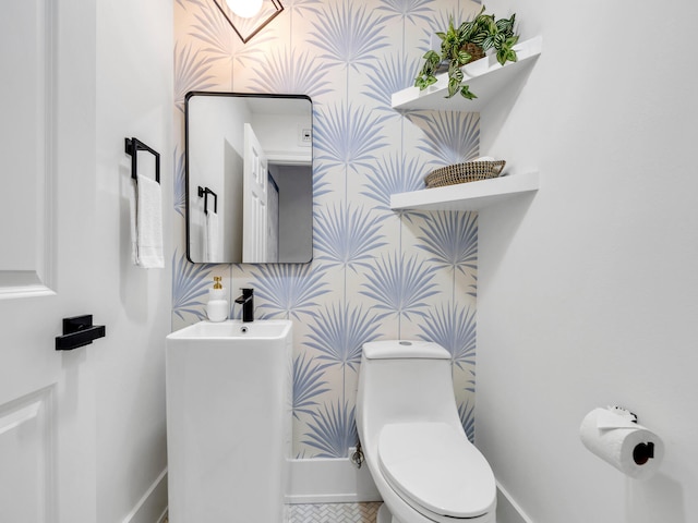 bathroom featuring sink and toilet