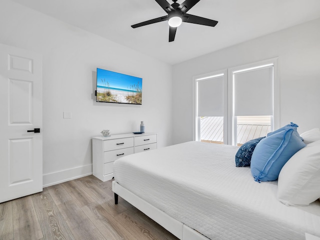 bedroom with ceiling fan and light hardwood / wood-style flooring