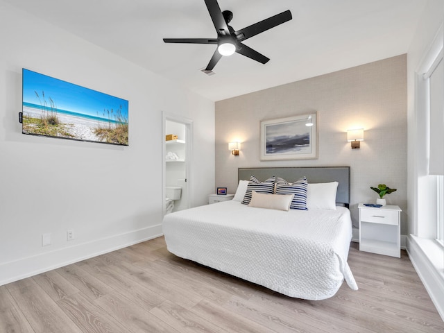 bedroom with ceiling fan and light hardwood / wood-style floors