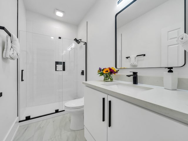 bathroom with walk in shower, vanity, and toilet