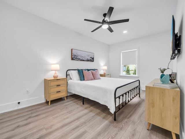 bedroom with light wood-type flooring and ceiling fan