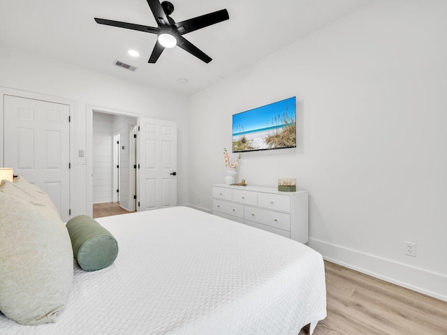 bedroom featuring light hardwood / wood-style floors and ceiling fan