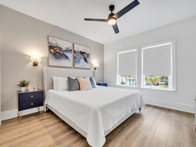 bedroom featuring light hardwood / wood-style floors and ceiling fan