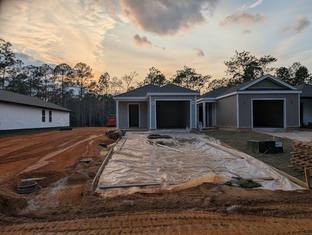 view of front of house featuring concrete driveway and a garage