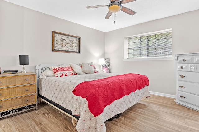 bedroom featuring light hardwood / wood-style floors and ceiling fan