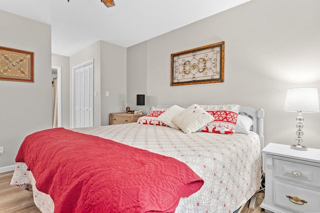 bedroom with a closet, ceiling fan, and light hardwood / wood-style floors